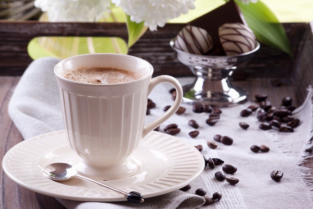 A cup of coffee and pralines