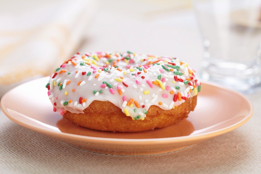 Doughnut with White Icing and Colored Sprinkles