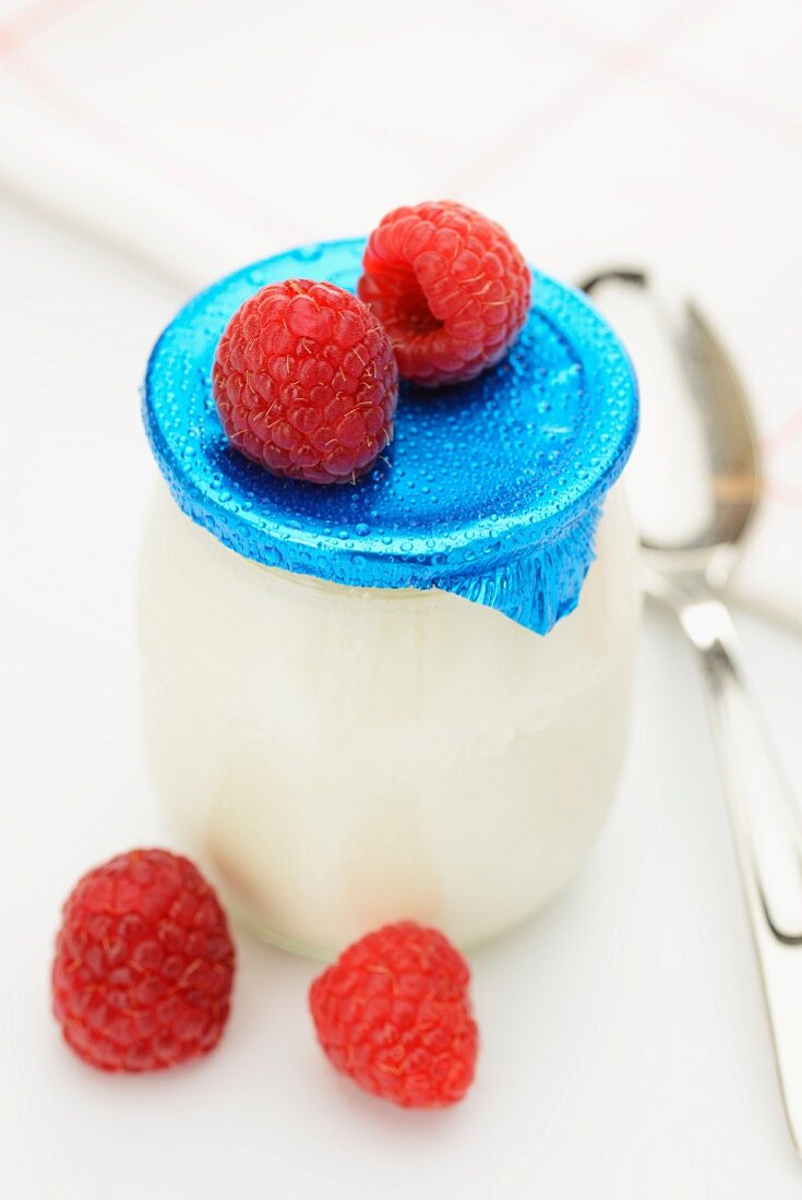Natural yogurt and fresh raspberries