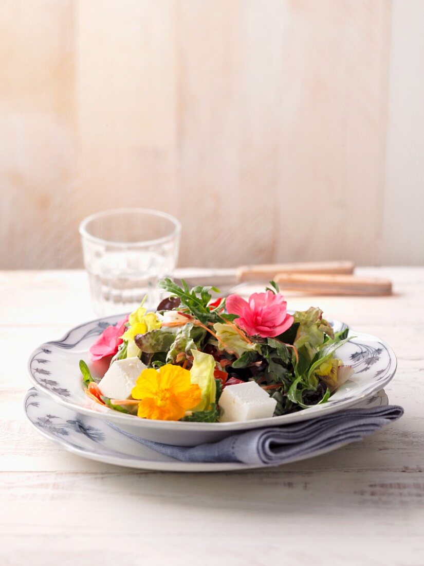 A colourful country salad with edible flowers