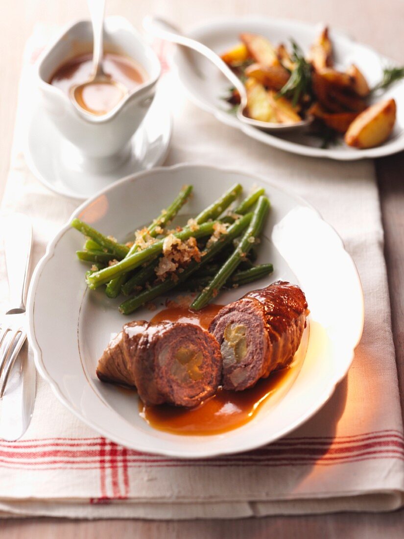 Beef roulade with a bean medley and roast potatoes