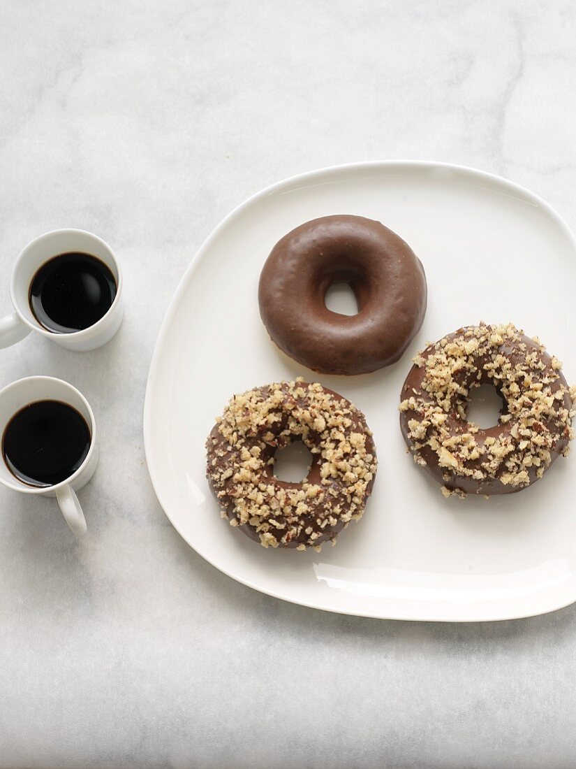 Dark Chocolate Covered Donuts; Two with Chopped Hazelnuts