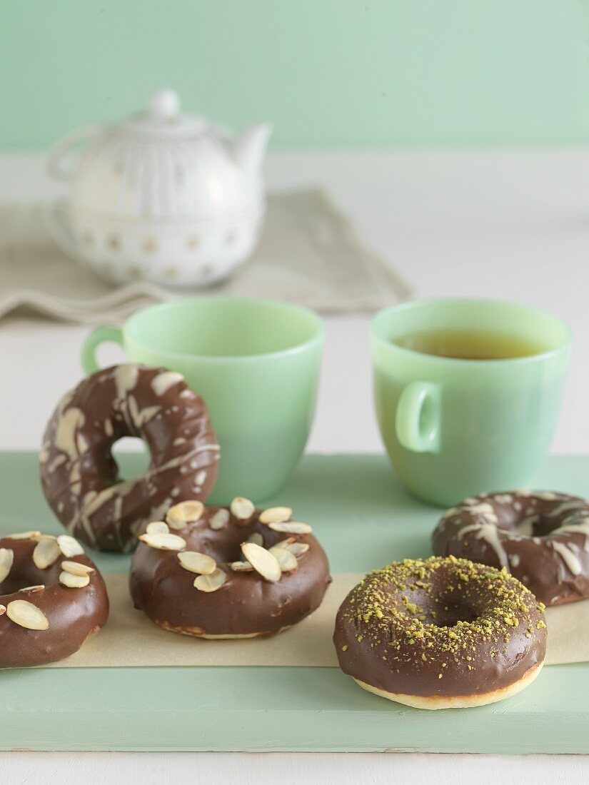 Chocolate Covered Donuts with Assorted Toppings; Pistachios, White Chocolate and Almonds