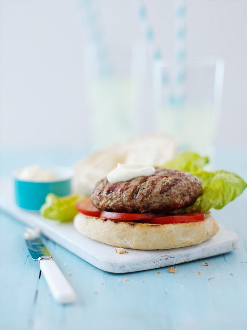 Turkey burger with tomato, lettuce and mayonnaise (Italy)