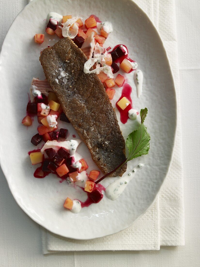 Fried trout fillets with beetroot salad and horseradish