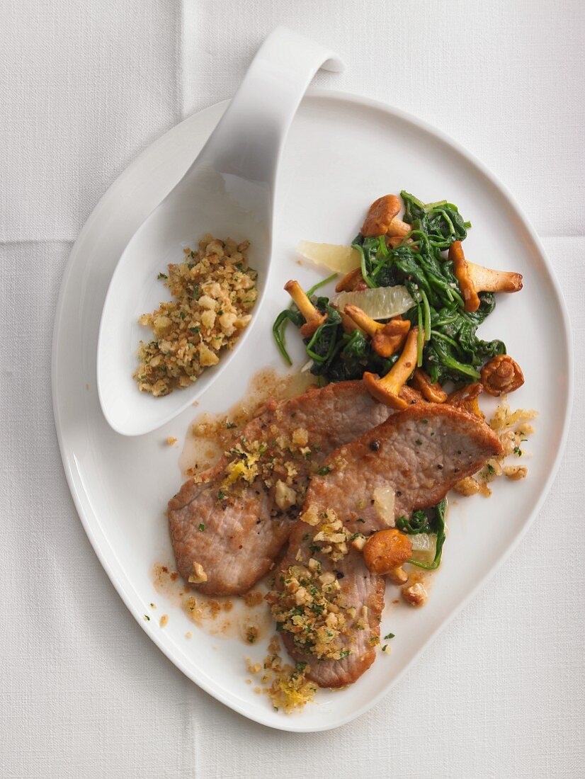 Scaloppine with chanterelle mushrooms and spinach