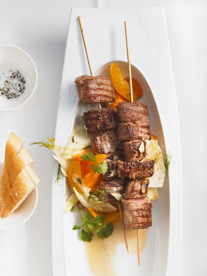 Grilled lamb kebabs with a carrot and fennel salad