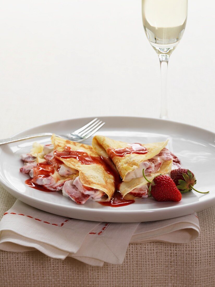 Strawberry crepes with strawberry syrup