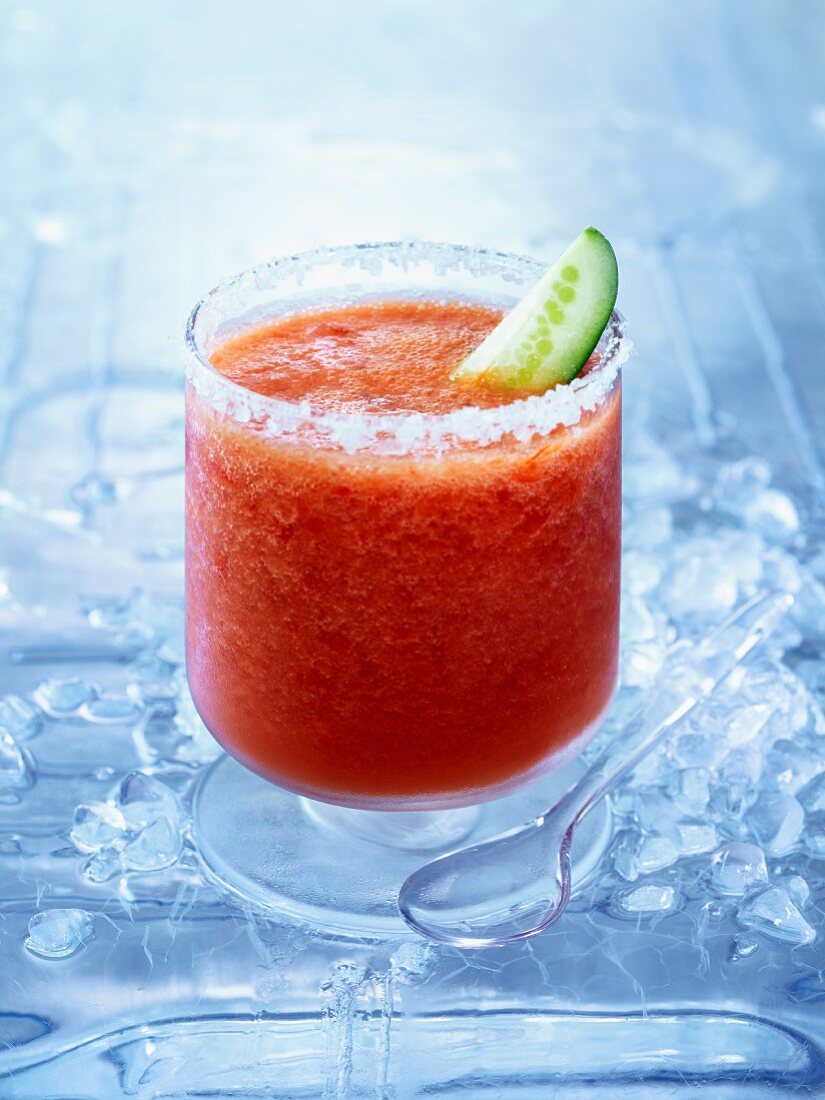 Frozen Bloody Mary with a slice of cucumber