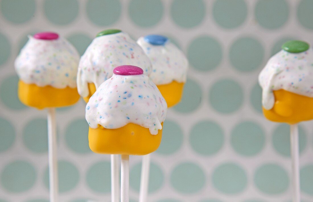 Cake pops decorated with colourful chocolate beans