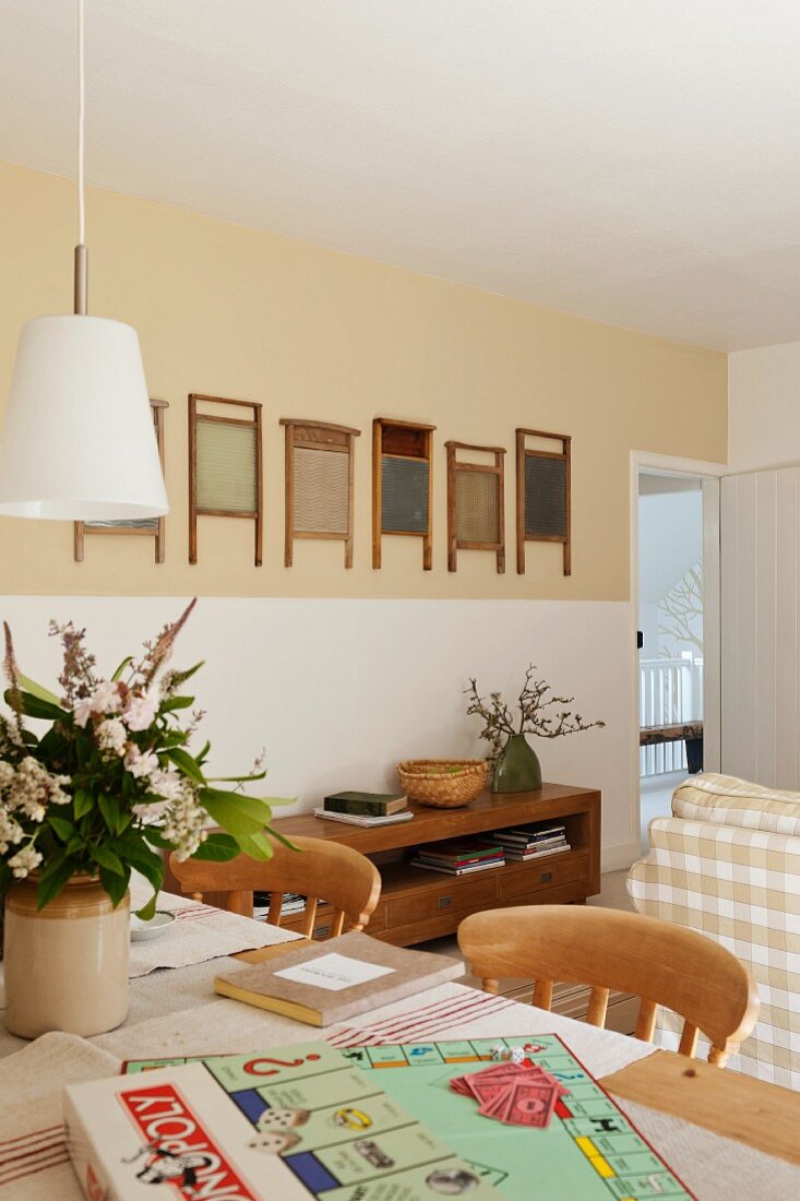 Living room with monopoloy set and walls decorated with vintage washboards