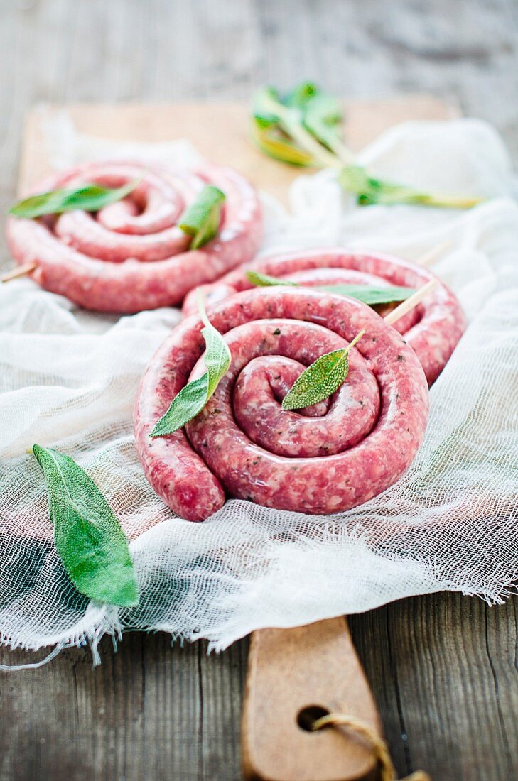 Raw coiled sausages