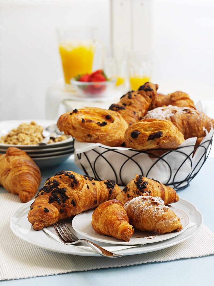 Croissants, pastries, cereals and orange juice