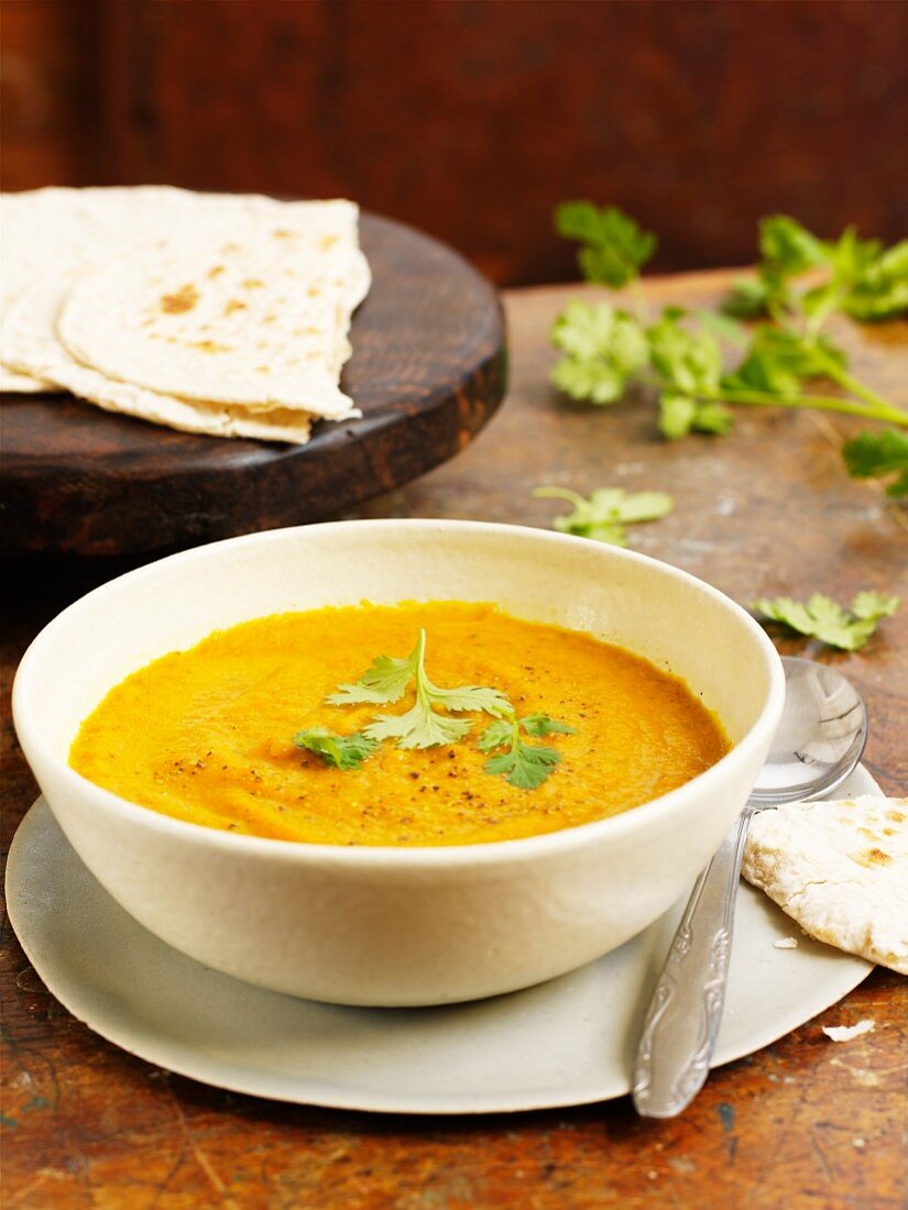 Carrot and curry soup with unleavened bread