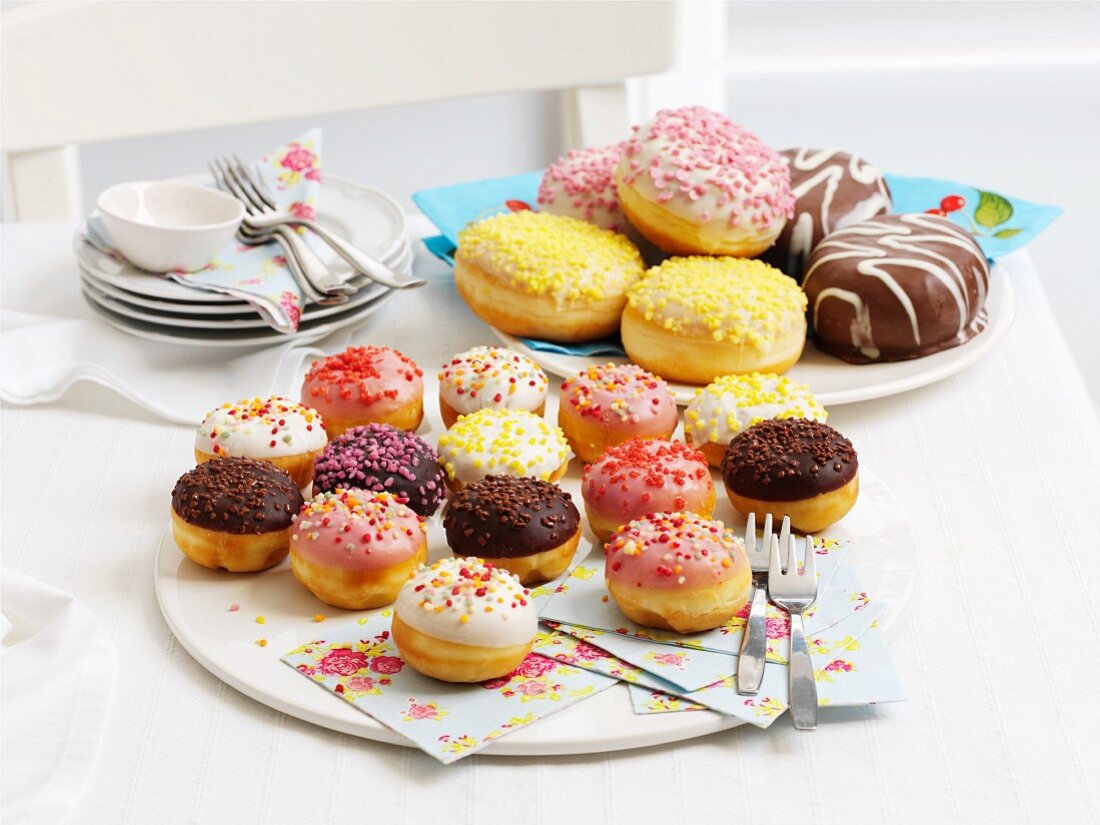Doughnuts with icing and sugar sprinkles