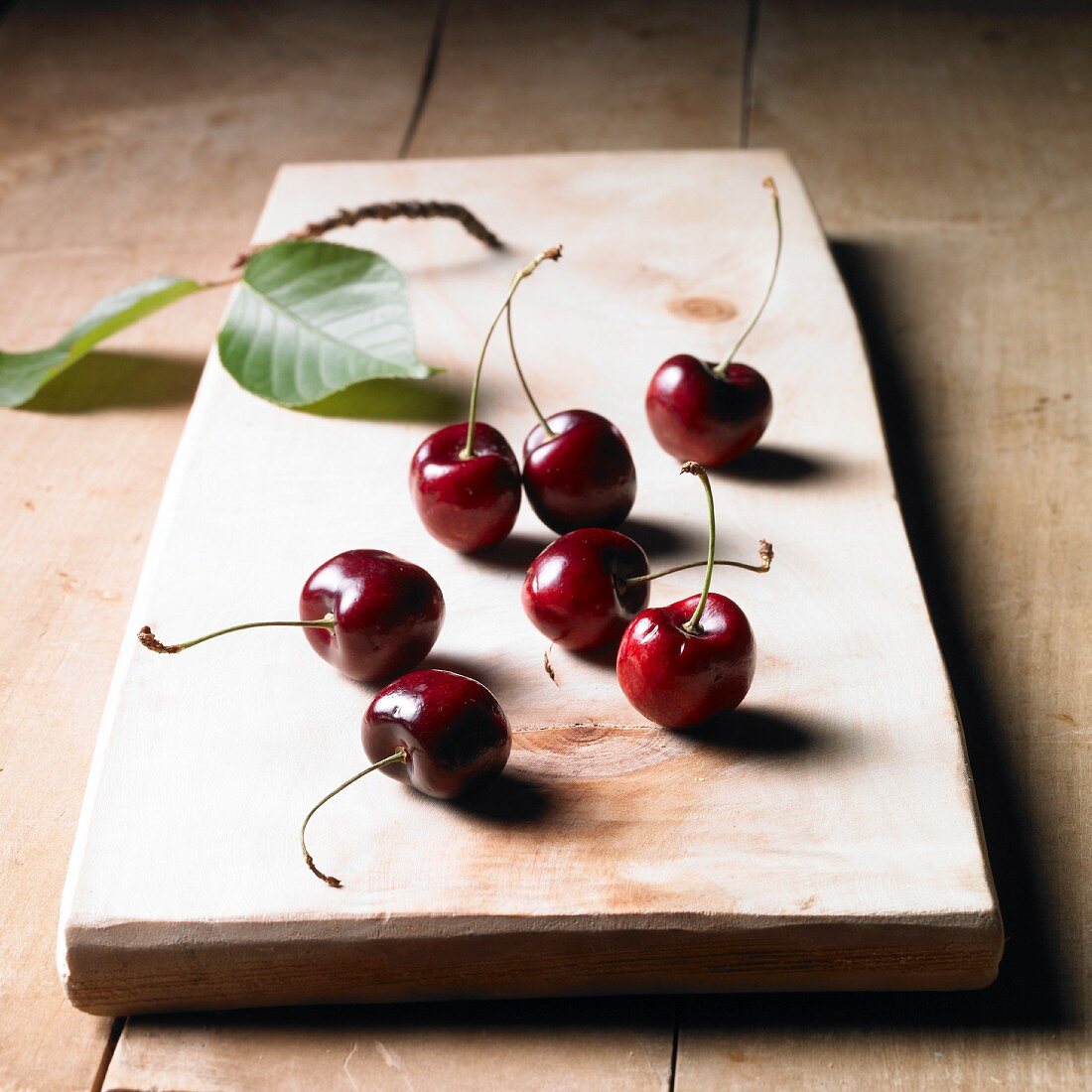 Cherries on a wooden board