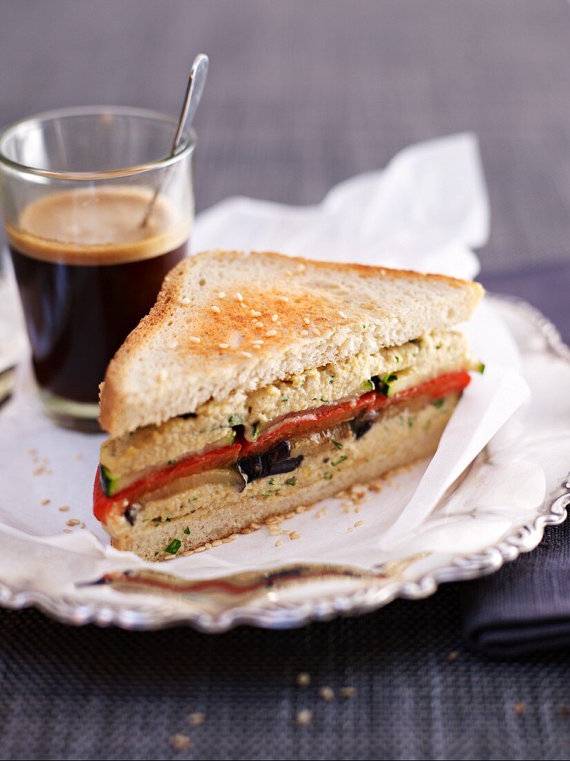 A hummus and grilled vegetable sandwich
