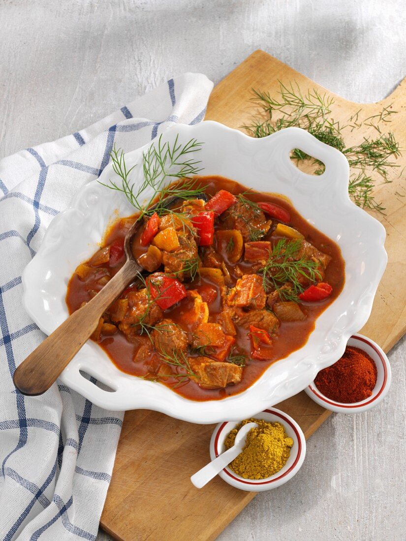 Pork knuckle goulash with pepper and dill