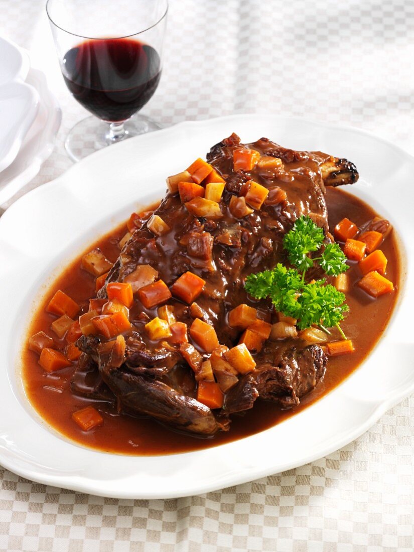 Braised venison shoulder in rose hip gravy with carrots