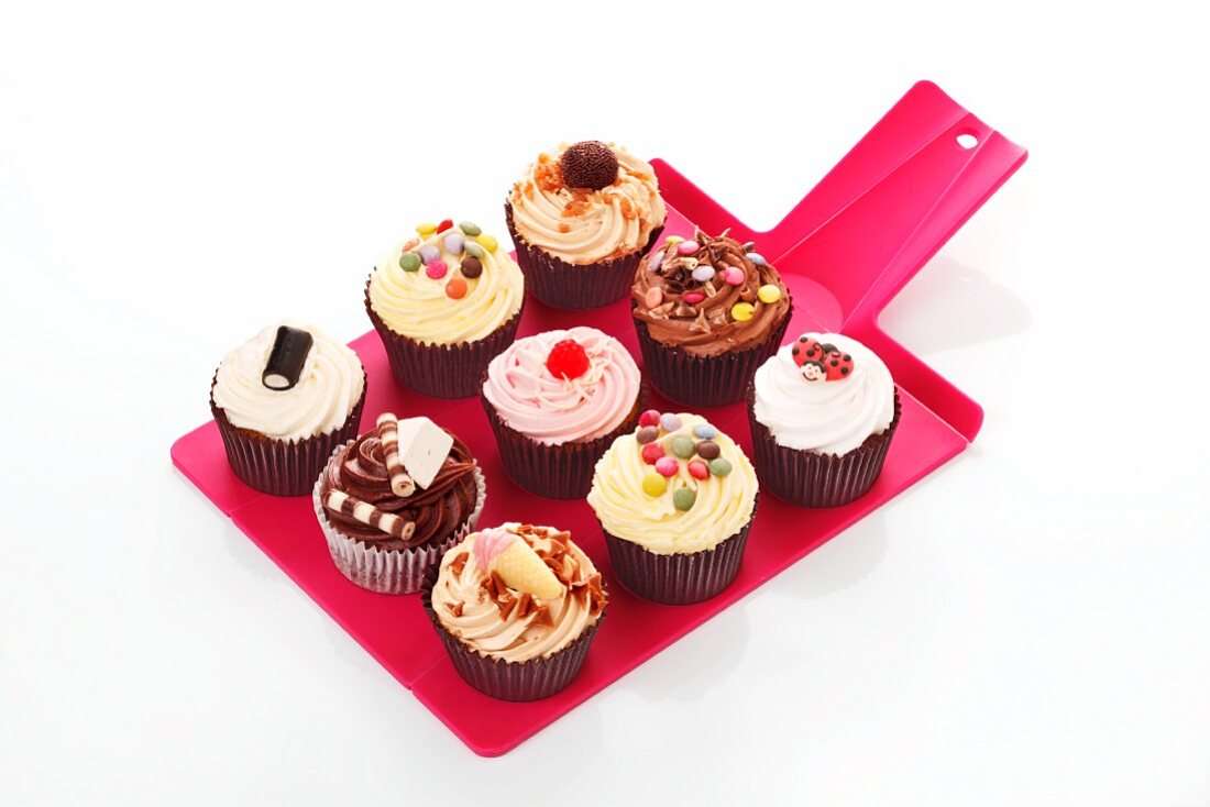 Various cupcakes on a tray
