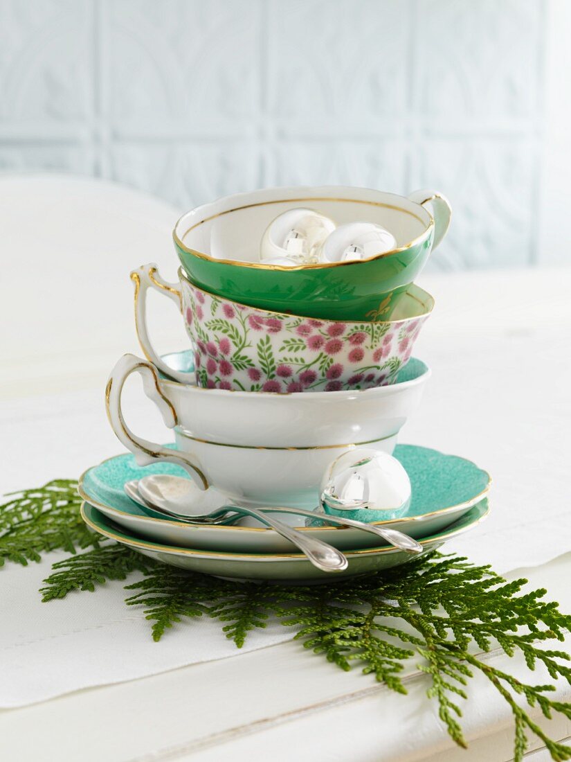 A stack of Christmas tea cups
