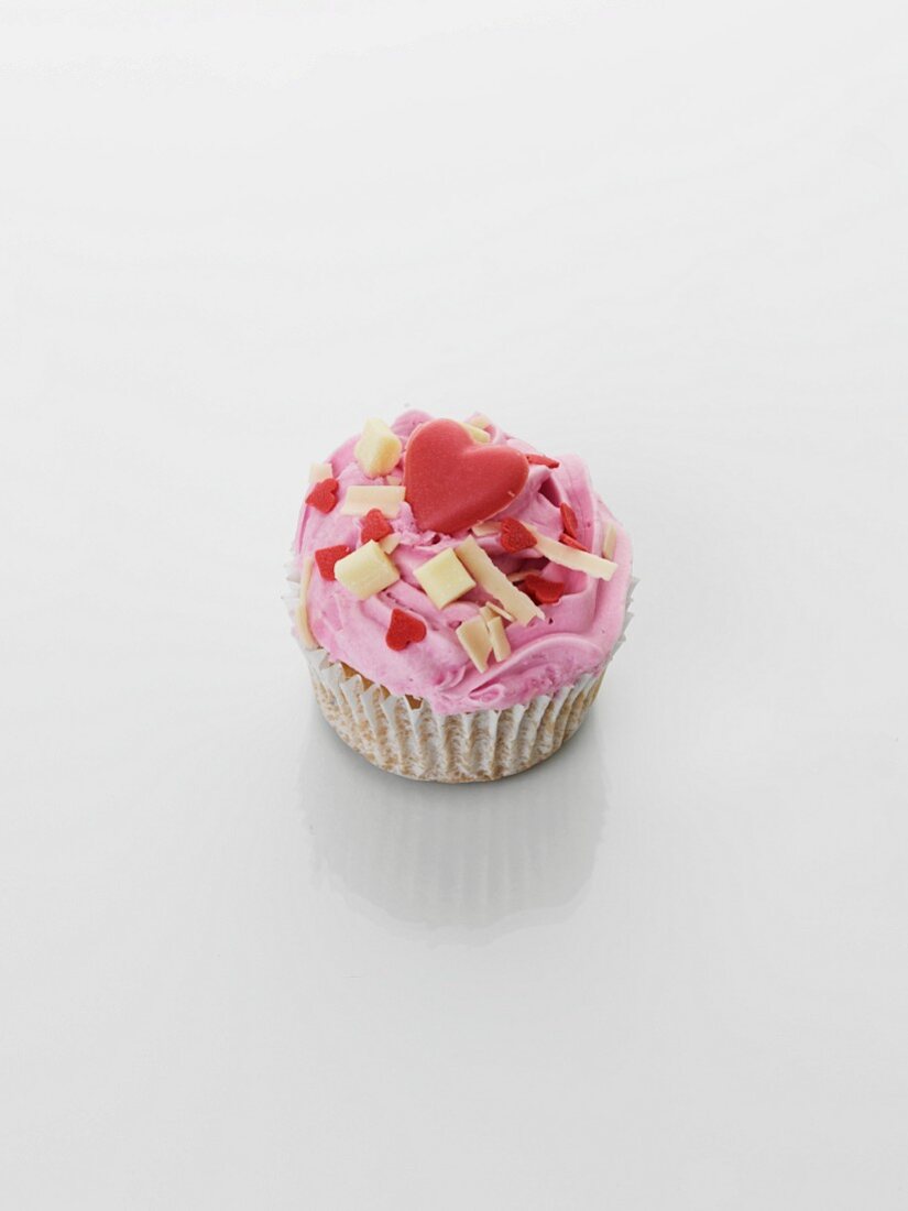 A cupcake with strawberry cream for Valentine's Day