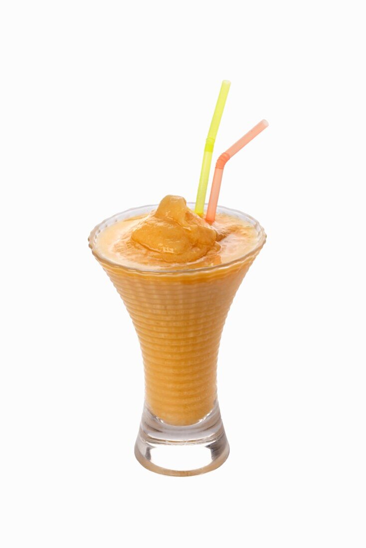 An apricot shake with straws