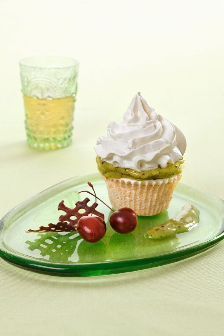 A cupcake with kiwi cream