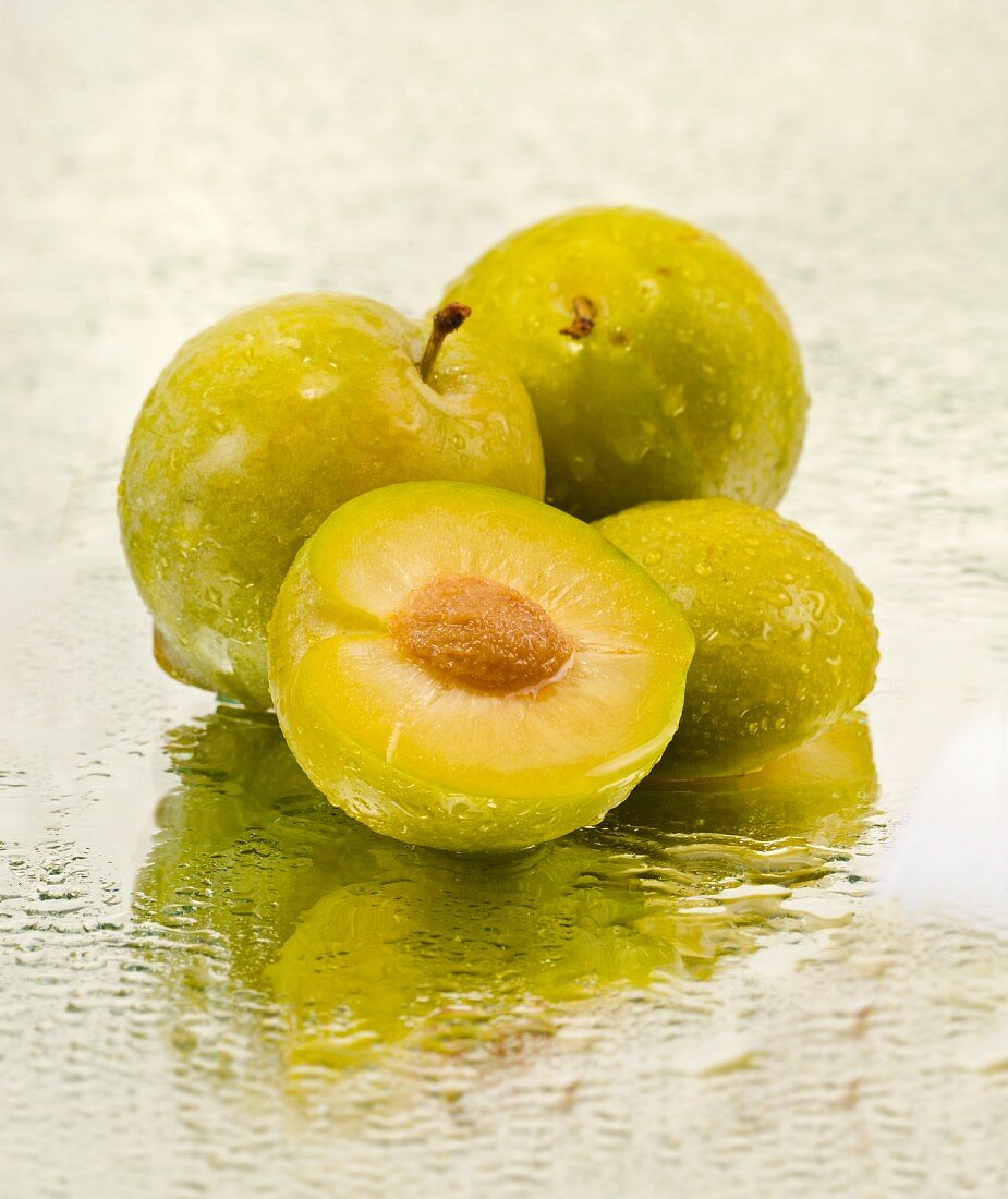 Greengages on a mirror