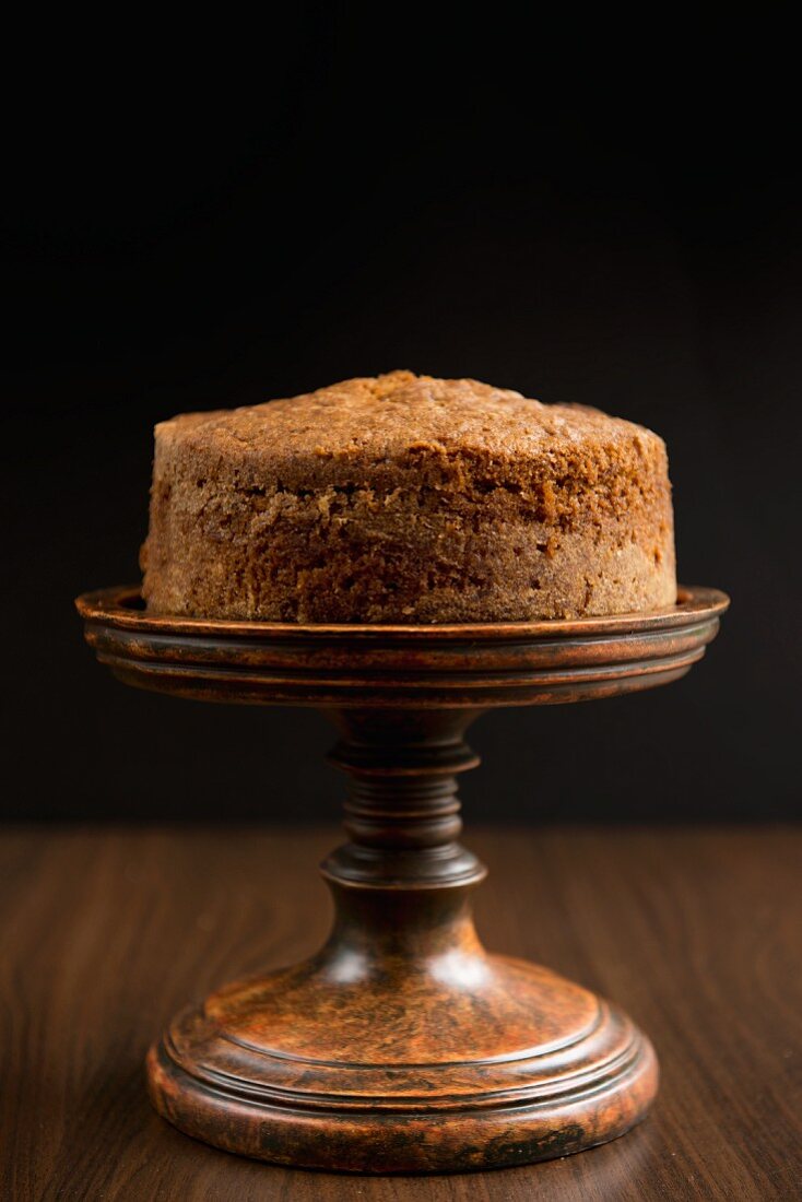 Carrot cake on a brown cake stand