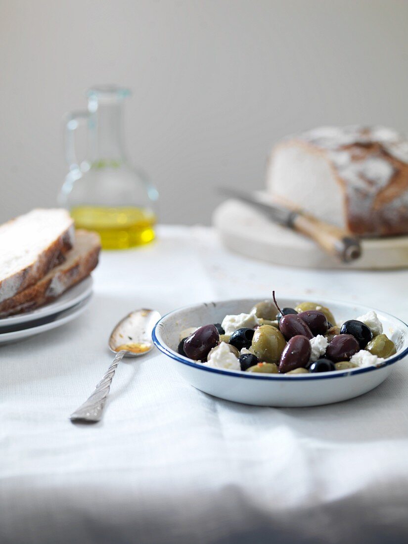 A bowl of olives with feta