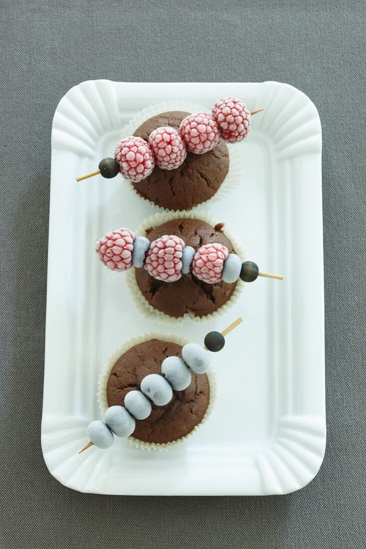 Chocolate muffins with frozen berry skewers