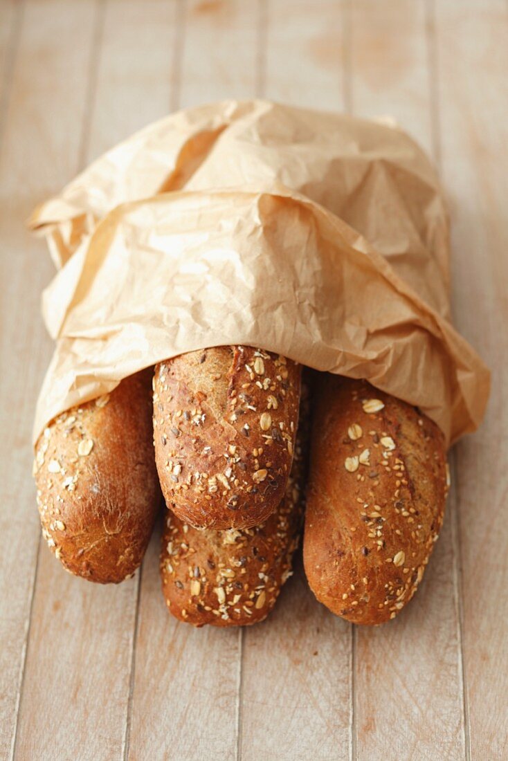 Seeded rolls in a paper bag