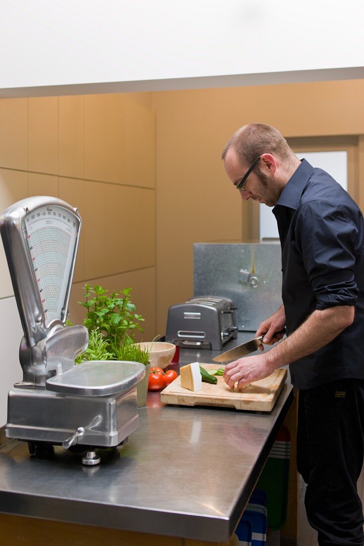 Man preparing food at kitchen counter