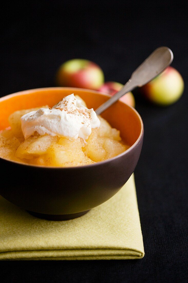 Bowl of Cooked Apples with Whipped Cream