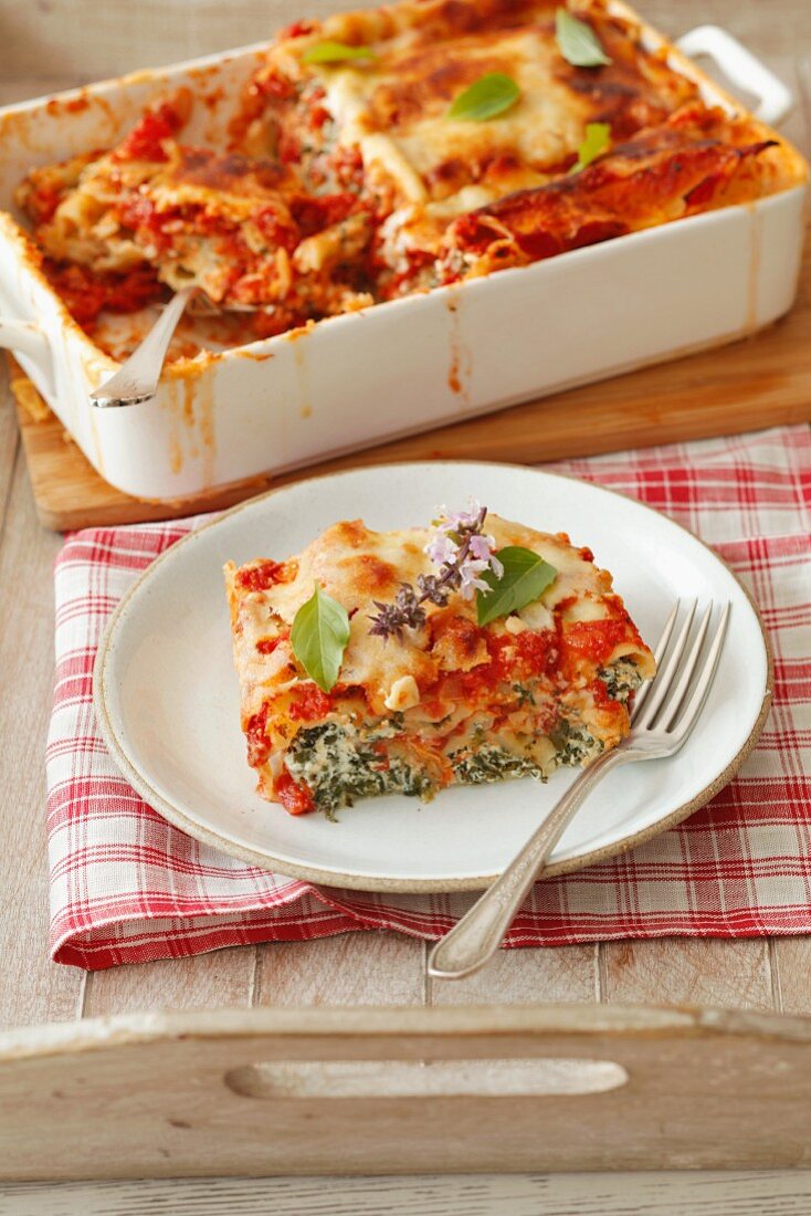 Cannelloni with spinach and ricotta in a tomato and Bechamel sauce