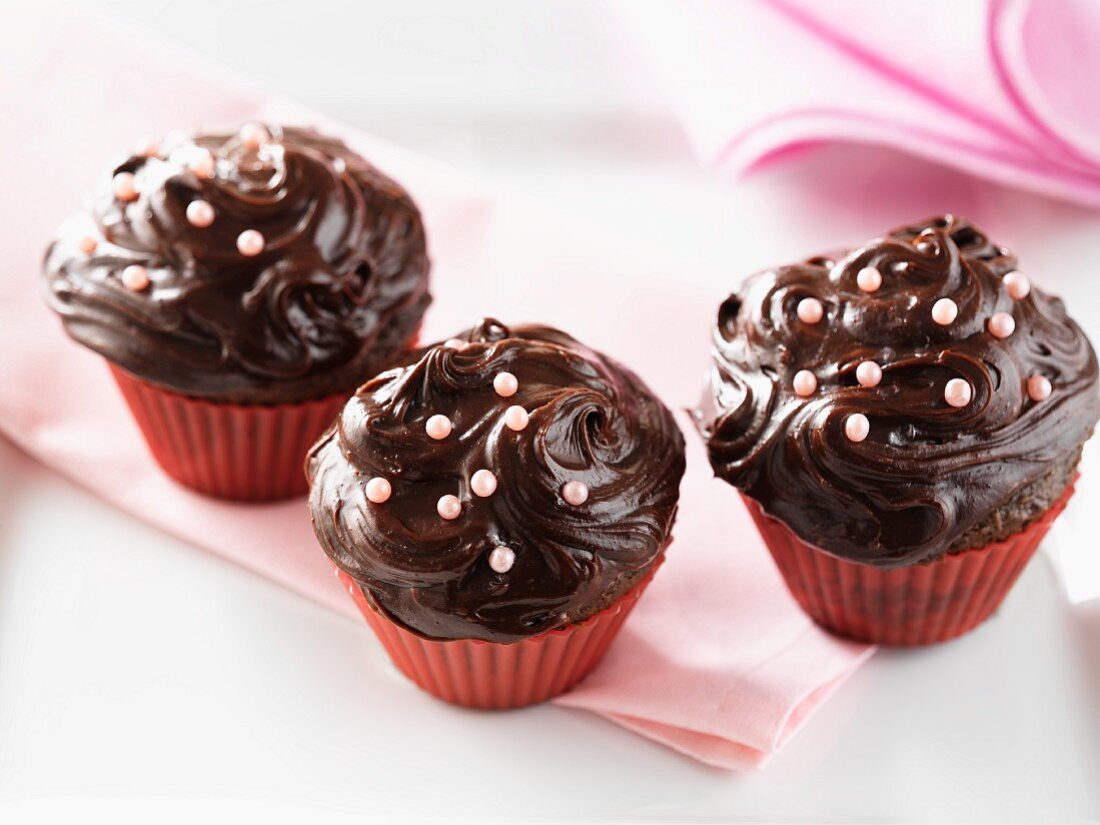 Chocolate fudge cupcakes with chocolate frosting and chocolate chip cookie topping