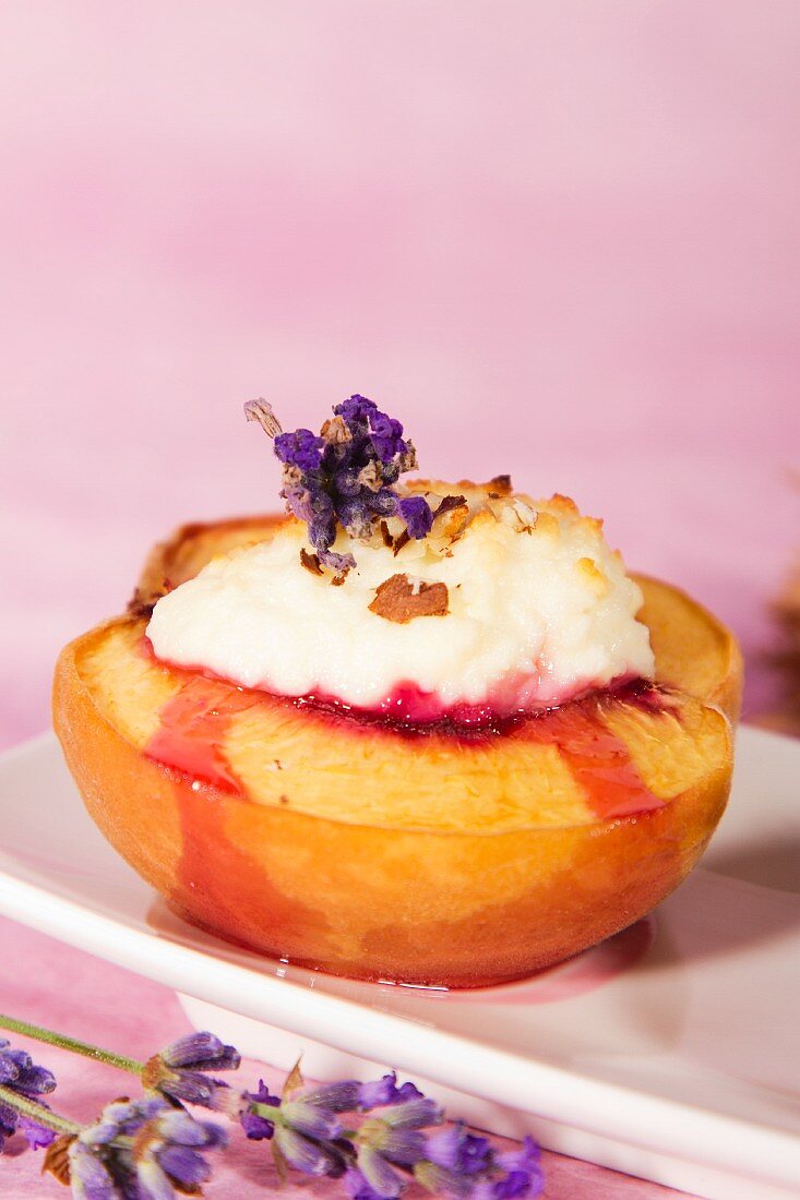 A gratinated peach with lavender flowers