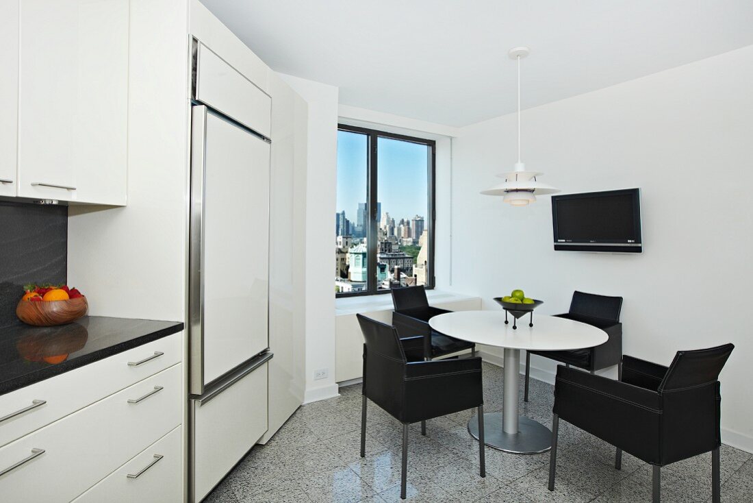 White and Back Kitchen with Table and Chairs