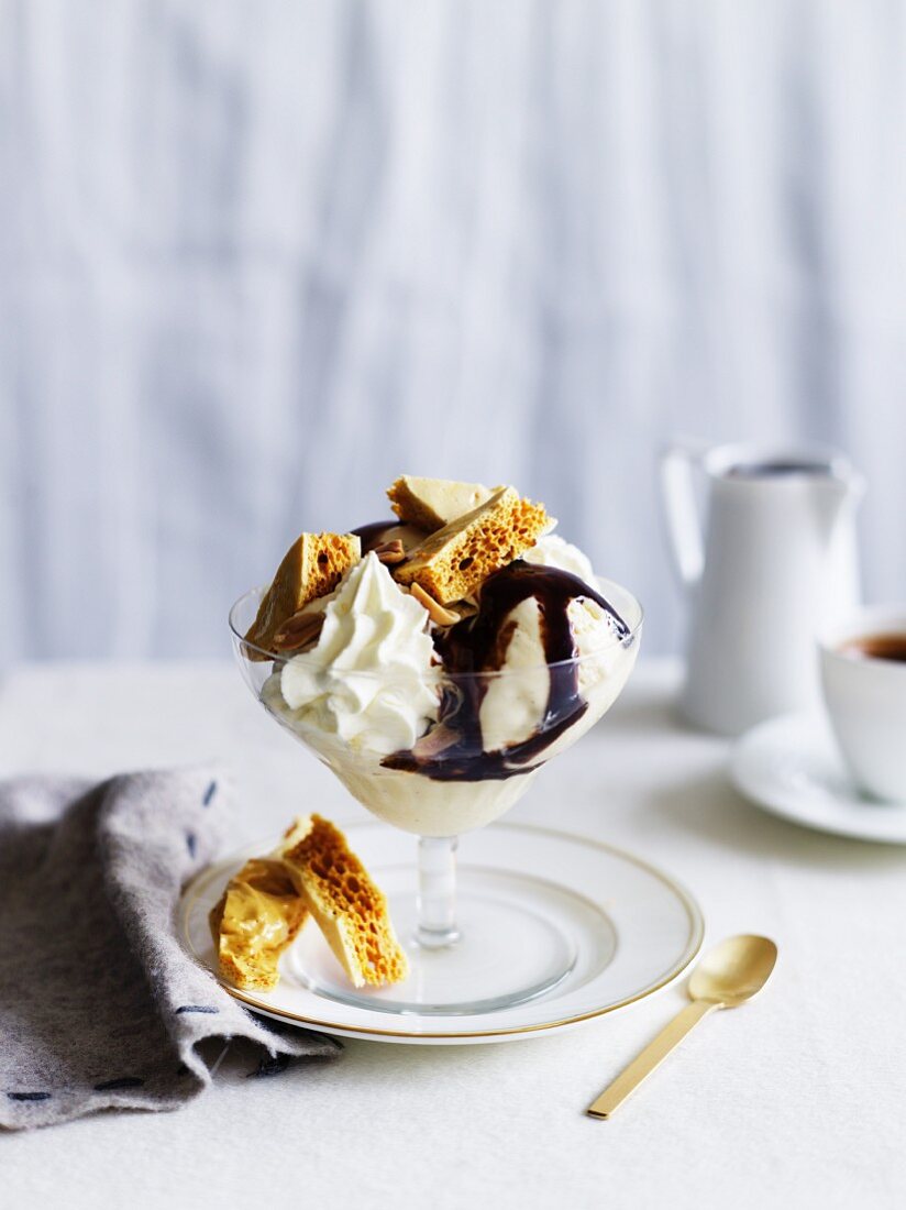 Ice cream sundaes with sweet pastries and cream