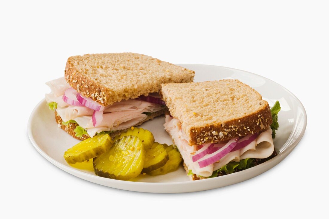 Turkey Sandwich on Wheat Bread; Halved with Pickles