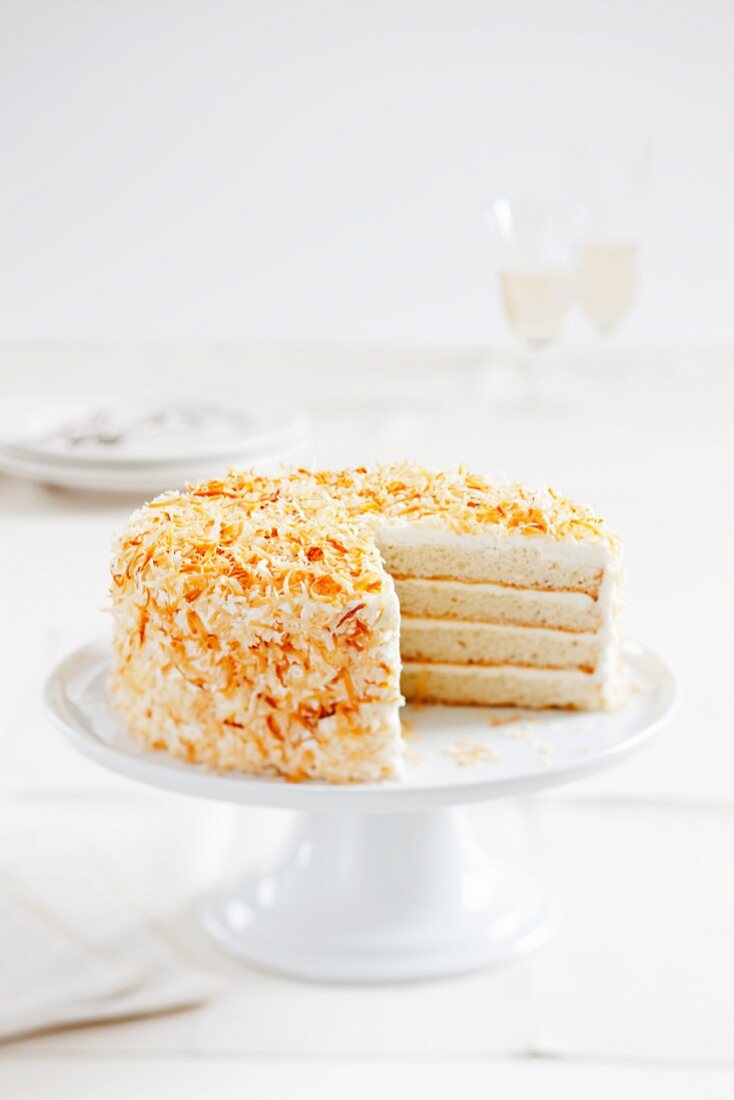 Layered Coconut Cake with a Slice Removed