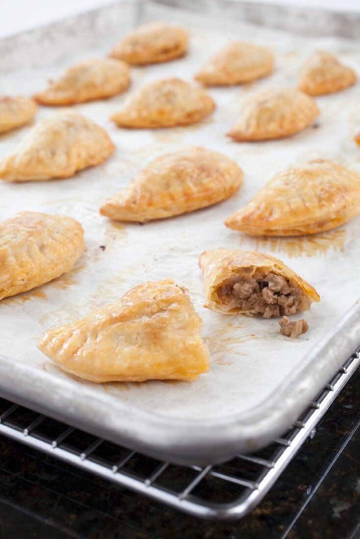 Beef and Cheese Empanadas on a Baking Sheet
