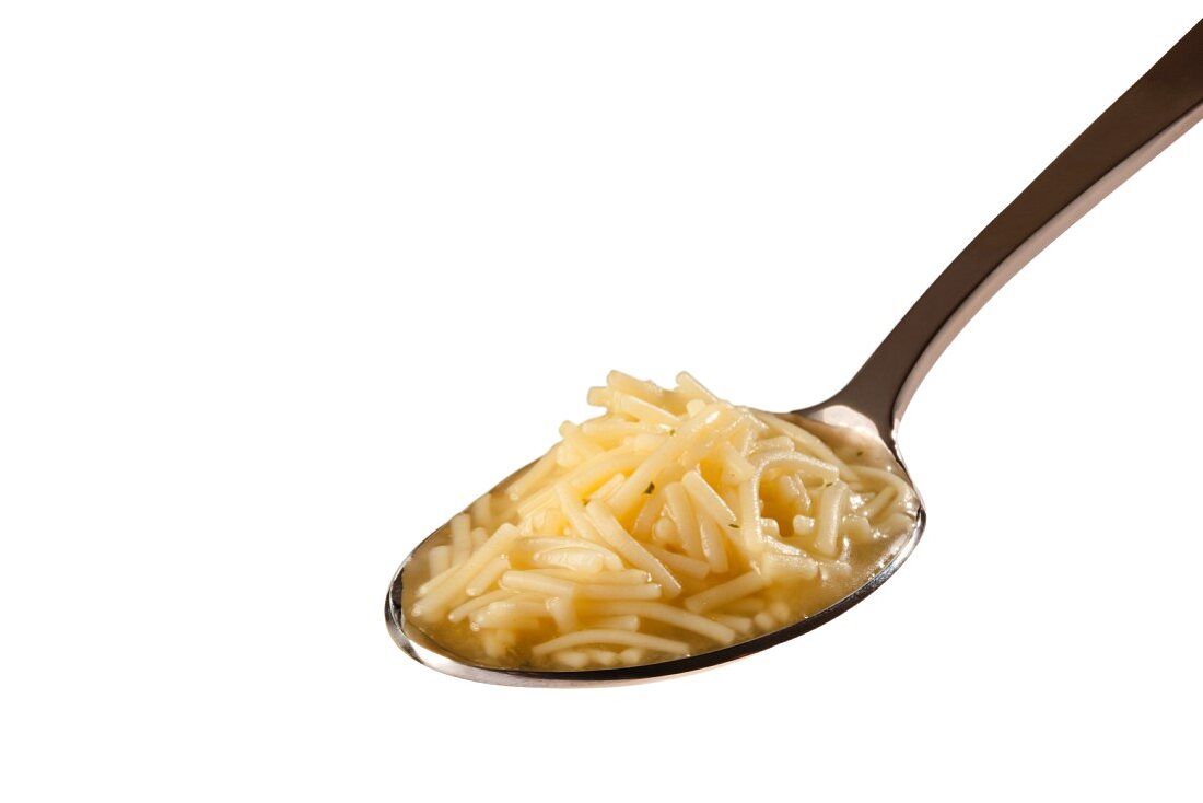 Spoonful of Chicken Noodle Soup on a White Background