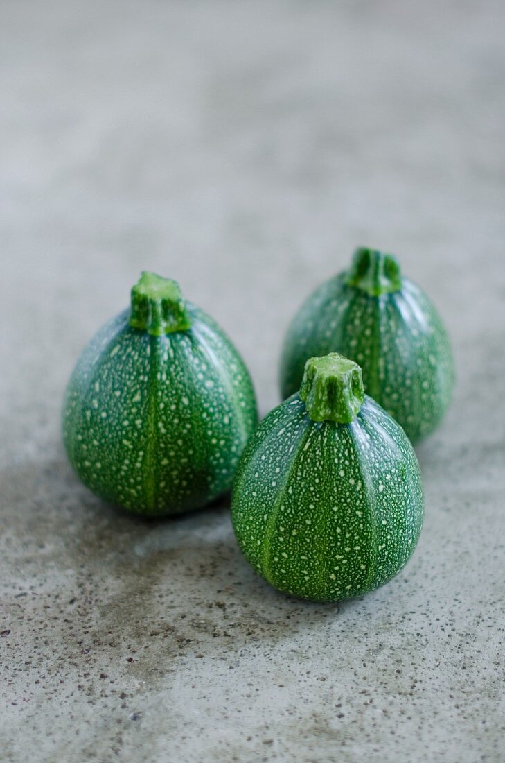 Three round courgettes