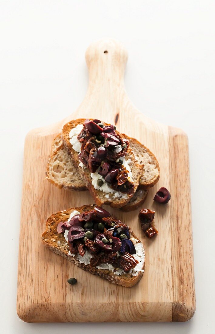 Bread Topped with Cheese and Olive Tapenade