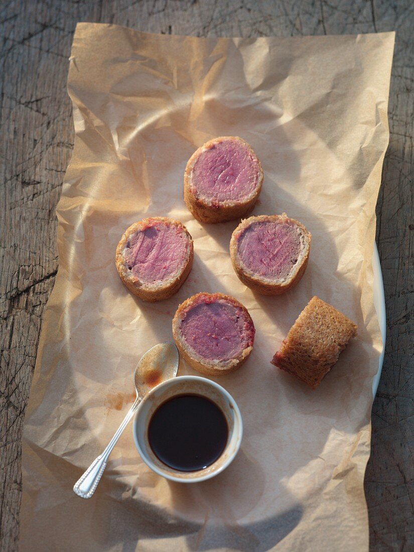 Saddle of venison wrapped in spice bread