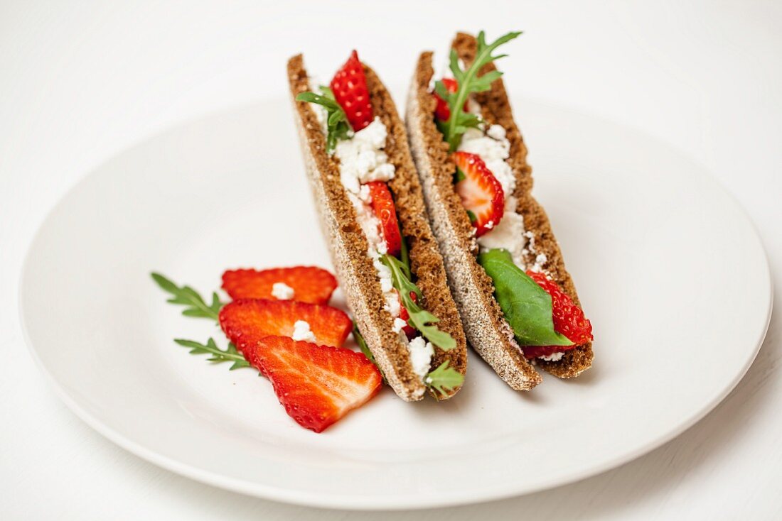 A toasted cream goat's cheese and strawberry sandwich