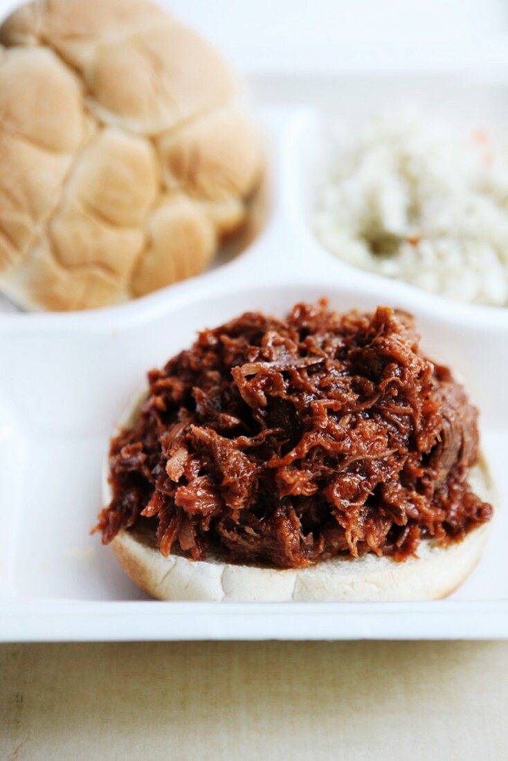 Barbecue Pulled Pork Sandwich in a Styrofoam To-Go Box with Cole Slaw