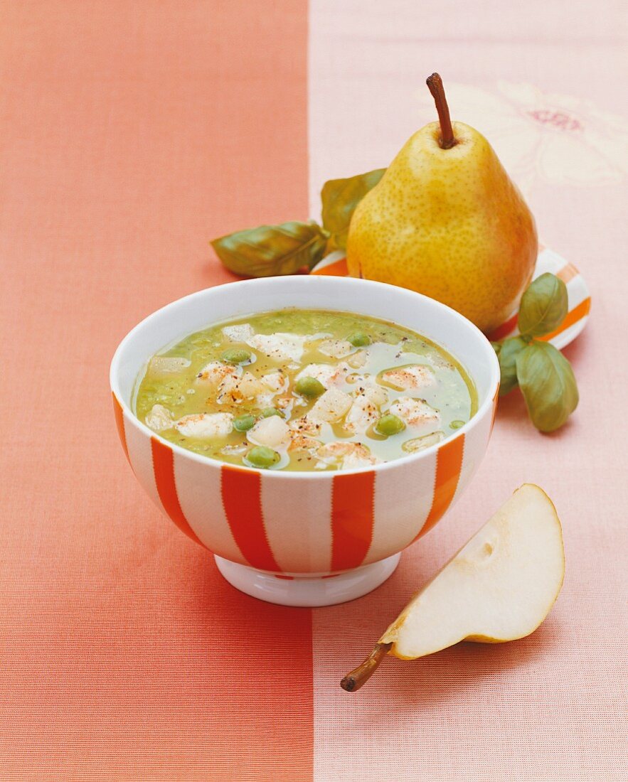 Cream of pea soup with pear and lobster